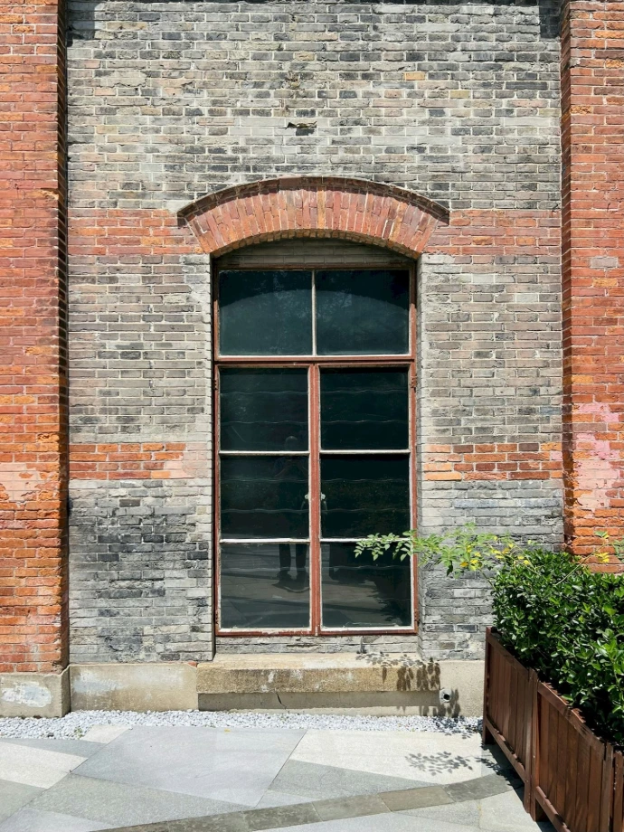 a window in a brick building